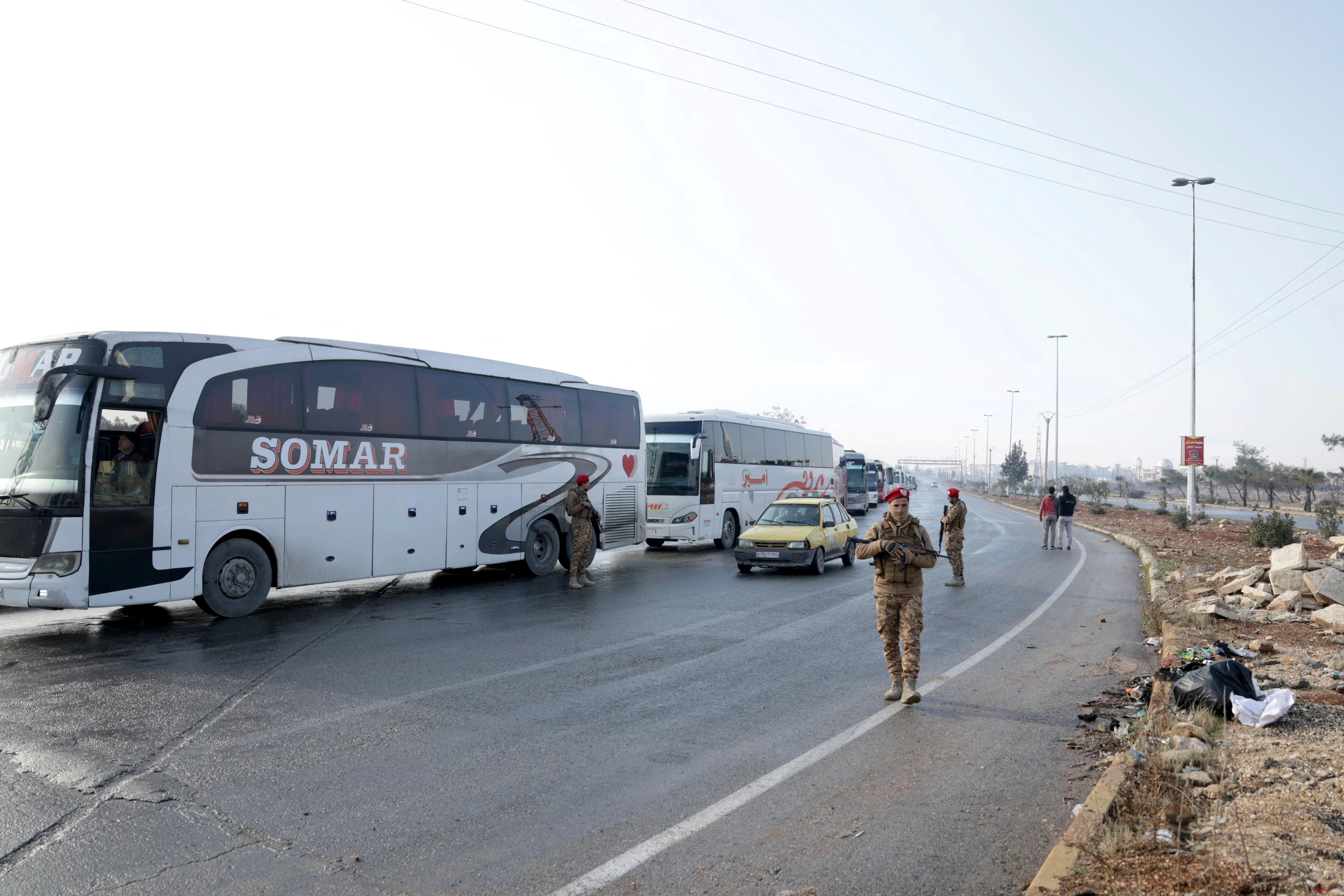Image of Syria prepares to bus Kurdish fighters out of Aleppo