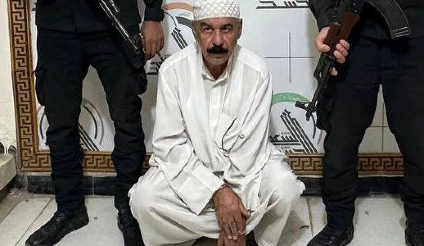 Image of PMF detains former Baath Party member in Basra’s Qurna district
