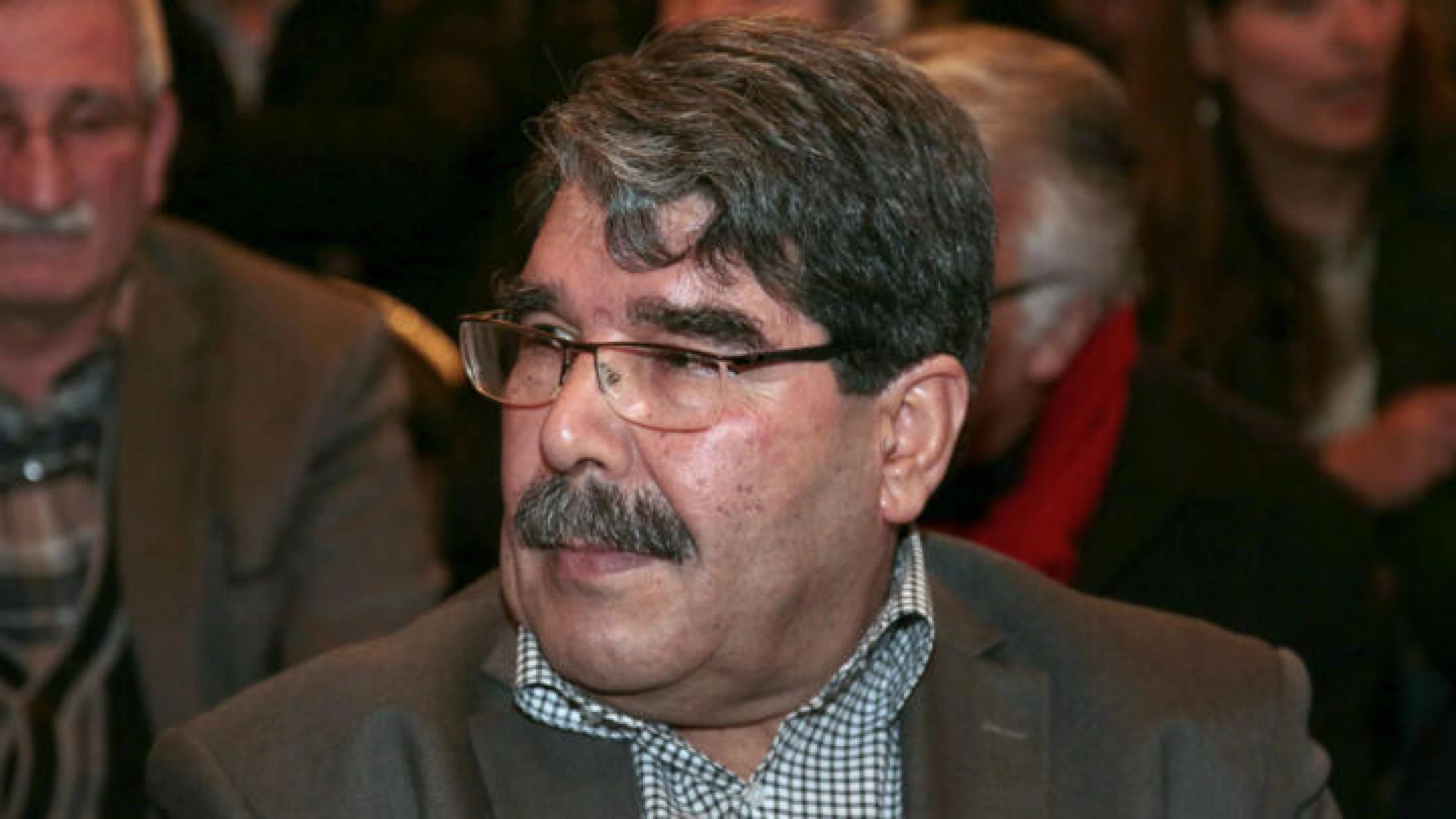 Image of PYD warns dissolving Kurdish forces would leave Rojava “defenseless”