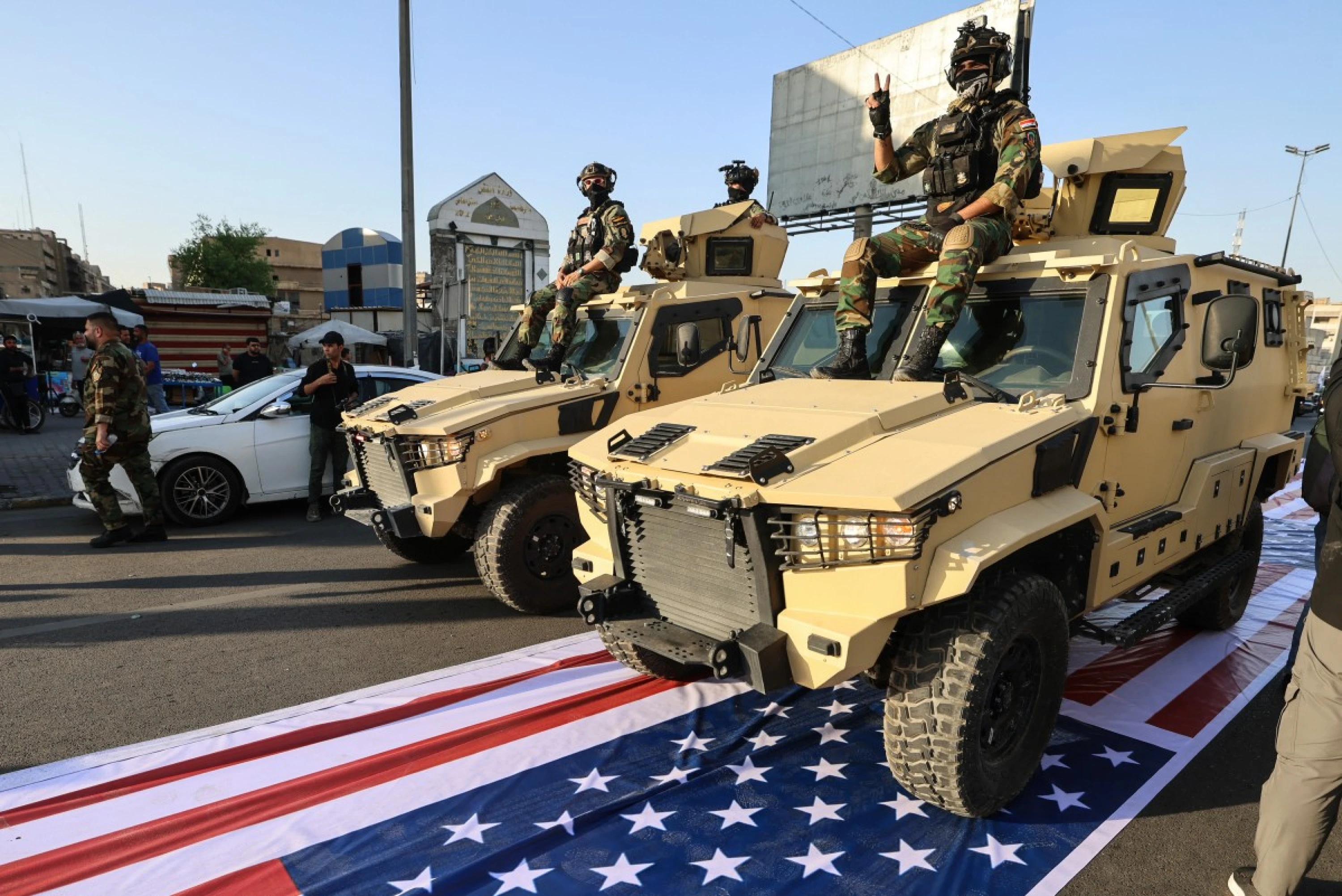 Image of Iraq arrests individuals accused of trampling US flag at PMF parade: Official 